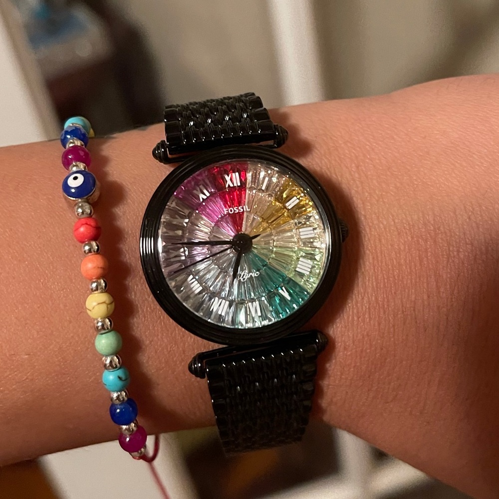 Black Fossil watch with multi colored stones.
